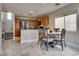 Kitchen and breakfast nook area with stainless steel appliances and stone flooring at 9140 Entrancing Ave, Las Vegas, NV 89149