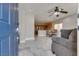 Open-concept living room with a partial view of the kitchen and dining area at 9140 Entrancing Ave, Las Vegas, NV 89149