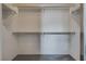 Walk-in closet with white walls, carpet floors, and shelving for organization at 9140 Entrancing Ave, Las Vegas, NV 89149