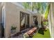 Charming backyard featuring a brick patio, artificial grass, and lush greenery for a serene outdoor living space at 939 Paisley St, Las Vegas, NV 89145