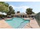 Community pool and recreation area with lounge chairs and covered seating for residents to relax and enjoy at 939 Paisley St, Las Vegas, NV 89145