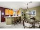 Open-concept dining area flowing into kitchen with ample counter seating at 939 Paisley St, Las Vegas, NV 89145