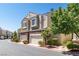Community offers a townhome and brick exterior design and attached garages at 939 Paisley St, Las Vegas, NV 89145