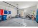 Spacious garage with ample storage, equipped with shelving and work space at 939 Paisley St, Las Vegas, NV 89145