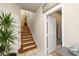 Hallway featuring the staircase and a door opening to the powder room at 939 Paisley St, Las Vegas, NV 89145