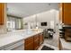 Sunlit kitchen offering a view into the living room, featuring a sky-high ceiling at 939 Paisley St, Las Vegas, NV 89145