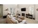 Inviting living room with fireplace, neutral color palette and lots of sunlight at 939 Paisley St, Las Vegas, NV 89145