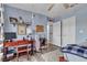Bright bedroom featuring wood floors, a desk area, and a ceiling fan at 9585 Teton Diablo Ave, Las Vegas, NV 89117