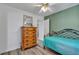 Inviting bedroom showcasing a wooden dresser and coordinating decor at 9585 Teton Diablo Ave, Las Vegas, NV 89117