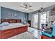 Stylish bedroom featuring hardwood floors, modern decor, and abundant natural light at 9585 Teton Diablo Ave, Las Vegas, NV 89117