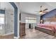 Spacious primary bedroom with en-suite bathroom and ceiling fan at 9585 Teton Diablo Ave, Las Vegas, NV 89117