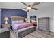 Primary bedroom with king size bed and ceiling fan at 9585 Teton Diablo Ave, Las Vegas, NV 89117