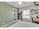 Well-lit bedroom with modern desk, open shelving, and en-suite bathroom at 9585 Teton Diablo Ave, Las Vegas, NV 89117