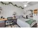 Relaxing bedroom with a decorative vines, ceiling fan, and mirrored closet at 9585 Teton Diablo Ave, Las Vegas, NV 89117
