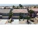 Stately two-story home with a well-manicured front yard, mature palm trees, and a spacious driveway at 9585 Teton Diablo Ave, Las Vegas, NV 89117