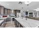 Bright kitchen features a large island with seating, stainless appliances, and modern cabinetry at 9585 Teton Diablo Ave, Las Vegas, NV 89117