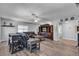 Open living area with hardwood floors, ceiling fan, and a large entertainment center at 9585 Teton Diablo Ave, Las Vegas, NV 89117