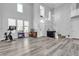 Open layout with high ceilings, offering ample natural light and wood-look floors at 9585 Teton Diablo Ave, Las Vegas, NV 89117