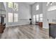 Spacious living area with soaring ceilings, wood-look floors, and abundant natural light at 9585 Teton Diablo Ave, Las Vegas, NV 89117
