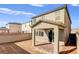 Back exterior of the home featuring a covered patio and block wall surround at 9886 Alpine Style Dr, Las Vegas, NV 89166