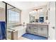 Modern bathroom with dual sinks, separate shower, and soaking tub at 9886 Alpine Style Dr, Las Vegas, NV 89166
