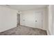 Neutral carpeted bedroom with several doors, and natural light from window at 9886 Alpine Style Dr, Las Vegas, NV 89166
