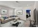 Cozy living room with stylish sectional and decorative accents at 9886 Alpine Style Dr, Las Vegas, NV 89166