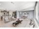 Inviting living space with modern furniture, adjacent kitchen, and neutral tones at 9886 Alpine Style Dr, Las Vegas, NV 89166
