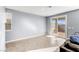 Bright, airy living room with sliding glass door leading to outdoor space at 9886 Alpine Style Dr, Las Vegas, NV 89166