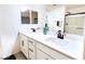 Bright bathroom featuring double sinks, white countertops, and matte black fixtures at 10021 Locking Biner Ave, Las Vegas, NV 89166