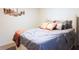 Neutral bedroom featuring a comfortable bed with decorative pillows and a soft throw at 10021 Locking Biner Ave, Las Vegas, NV 89166