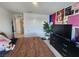 Bedroom featuring bold decor, a large window, and ample closet space at 10021 Locking Biner Ave, Las Vegas, NV 89166