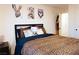 Charming bedroom with a leopard print comforter and unique wall art at 10021 Locking Biner Ave, Las Vegas, NV 89166