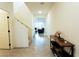 Bright foyer with tile flooring, view of staircase, and open living space at 10021 Locking Biner Ave, Las Vegas, NV 89166