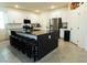 Spacious kitchen with a large island, seating, and modern appliances at 10021 Locking Biner Ave, Las Vegas, NV 89166