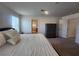 Bright main bedroom featuring plush bedding, neutral walls, and a dark wood dresser at 10021 Locking Biner Ave, Las Vegas, NV 89166