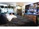 Cozy main bedroom with lots of plants and bright TV at 10021 Locking Biner Ave, Las Vegas, NV 89166