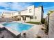 Modern backyard features a pool, tanning ledge, patio, turf, and gravel landscaping at 10021 Locking Biner Ave, Las Vegas, NV 89166