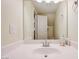 Clean bathroom with a large mirror reflecting a sink, white countertop, and neutral wall paint at 1073 Pleasure Ln # 2, Henderson, NV 89002