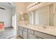 Bright bathroom features a double sink vanity, large mirror, and modern fixtures at 1073 Pleasure Ln # 2, Henderson, NV 89002
