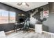 Well-lit bedroom space with a desk, gaming setup, and unique geometric wall decor at 1073 Pleasure Ln # 2, Henderson, NV 89002