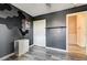 Stylish bedroom featuring a geometric accent wall, modern flooring, and closet space at 1073 Pleasure Ln # 2, Henderson, NV 89002