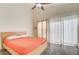 Bright bedroom with a modern bed and access to a private outdoor space with natural light at 1073 Pleasure Ln # 2, Henderson, NV 89002