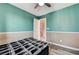 Cozy bedroom with modern flooring and neutral two-tone walls, creating a calming atmosphere at 1073 Pleasure Ln # 2, Henderson, NV 89002