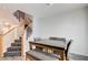 Dining area featuring a modern table with a staircase nearby and neutral tones for a welcoming space at 1073 Pleasure Ln # 2, Henderson, NV 89002