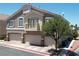 Charming two-story home featuring a three-car garage and a well-manicured lawn with mature tree at 1073 Pleasure Ln # 2, Henderson, NV 89002