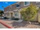 Cozy single-story home with well-maintained landscaping, a stone pathway, and a welcoming entrance at 1073 Pleasure Ln # 2, Henderson, NV 89002