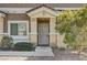Charming single-story home entrance featuring a security door and low-maintenance desert landscaping at 1073 Pleasure Ln # 2, Henderson, NV 89002