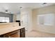 Open kitchen area featuring stainless steel appliances and a breakfast bar with barstool seating at 1073 Pleasure Ln # 2, Henderson, NV 89002
