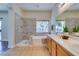 Bathroom featuring a soaking tub, shower, and double vanity at 1274 Doggett Ave, Las Vegas, NV 89123